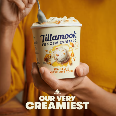 Person holding a container of Tillamook Sea Salt & Honeycomb Toffee Frozen Custard.