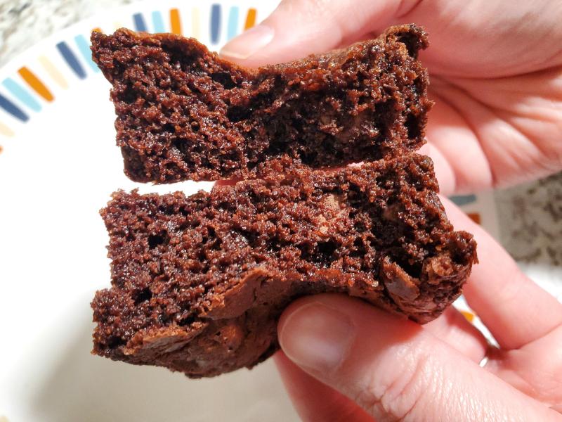 A closeup of a Good Hope Bakery Gluten-Free, Dairy-Free Brownie with a cake-like texture and chocolate chips.